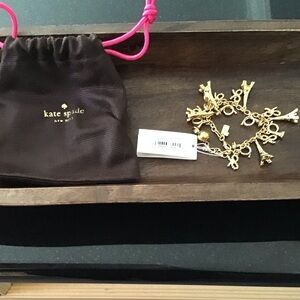 Kate Spade Gold Parisian Charm Bracelet with Brown Pouch